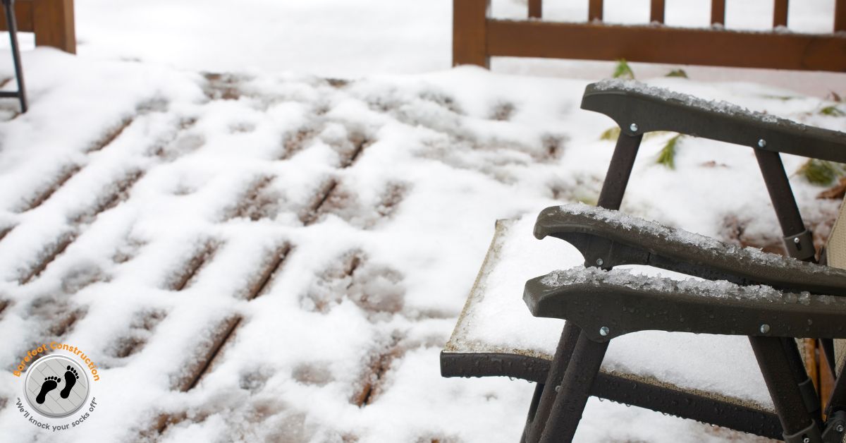 wood deck covered in snow - Barefoot Construction deck winterization