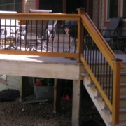 new deck with wood and black railings - Barefoot Construction decking materials