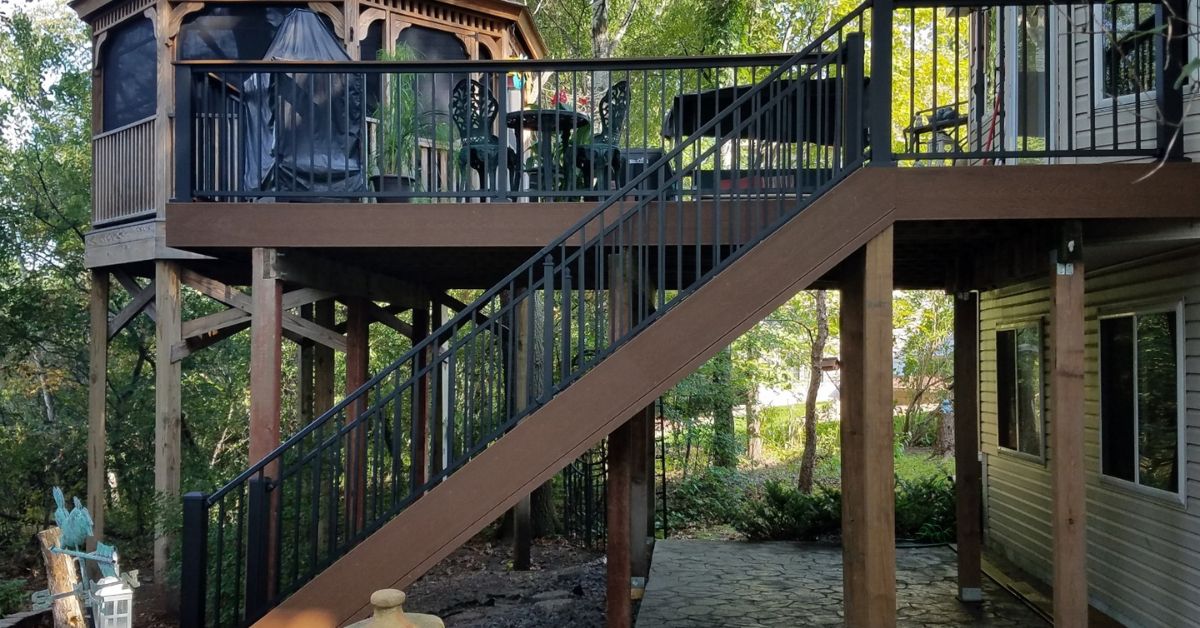 composite deck with black railings and stairs - Barefoot Construction deck construction