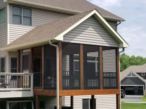detatched garage with a white door - Barefoot Construction Deck Construction, Basement Finishings and Home Additions