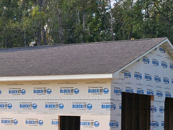 detatched garage with a white door - Barefoot Construction Deck Construction, Basement Finishings and Home Additions