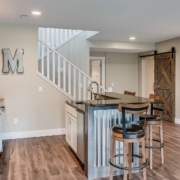 BarefootConstruction-basement-remodel-011020251 finished basement with a wet bar - Barefoot Construction basement remodel