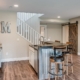 finished basement with a wet bar - Barefoot Construction basement remodel