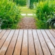 wood deck with view of large green plants - Barefoot Construction deck construction