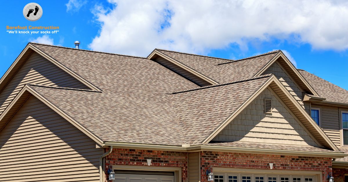suburban home with a new roof with brown asphalt shingles - Barefoot Construction roof replacement