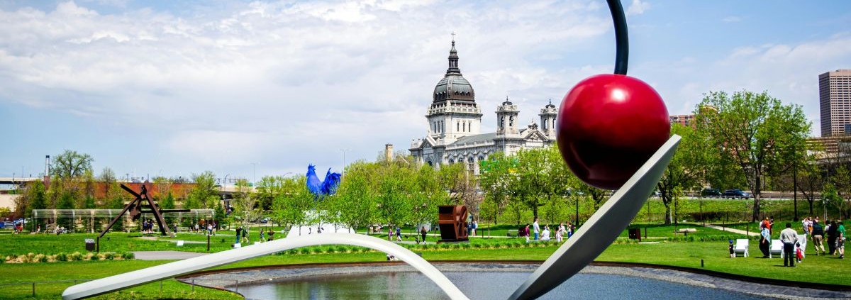 sculpture garden with large metal spoon and a red cherry - Barefoot Construction building a deck