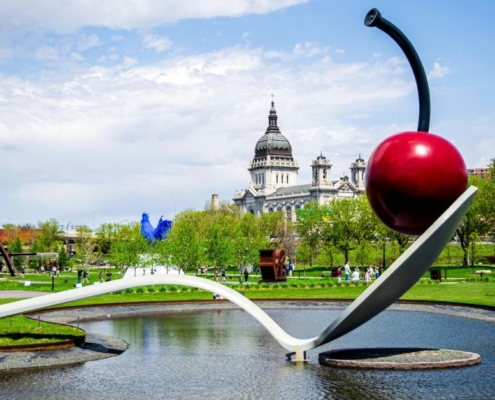 sculpture garden with large metal spoon and a red cherry - Barefoot Construction building a deck