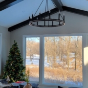 home addition with a large window and a chandelier - Barefoot Construction home addition