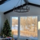 home addition with a large window and a chandelier - Barefoot Construction home addition