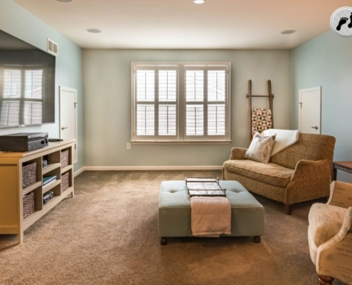 cozy living area in a finished basement - Barefoot Construction basement remodel
