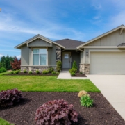 exterior of a suburban home in the spring time - Barefoot Construction basement finishing