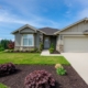 exterior of a suburban home in the spring time - Barefoot Construction basement finishing