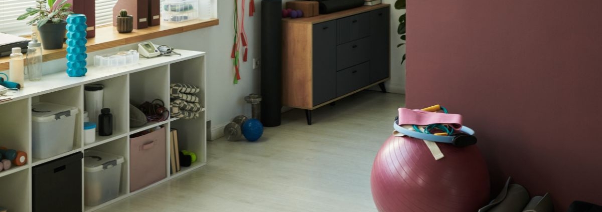 workout equipment in a finished basement - Barefoot Construction basement home gym