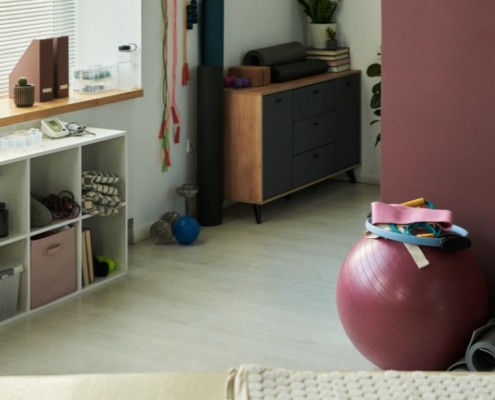 workout equipment in a finished basement - Barefoot Construction basement home gym