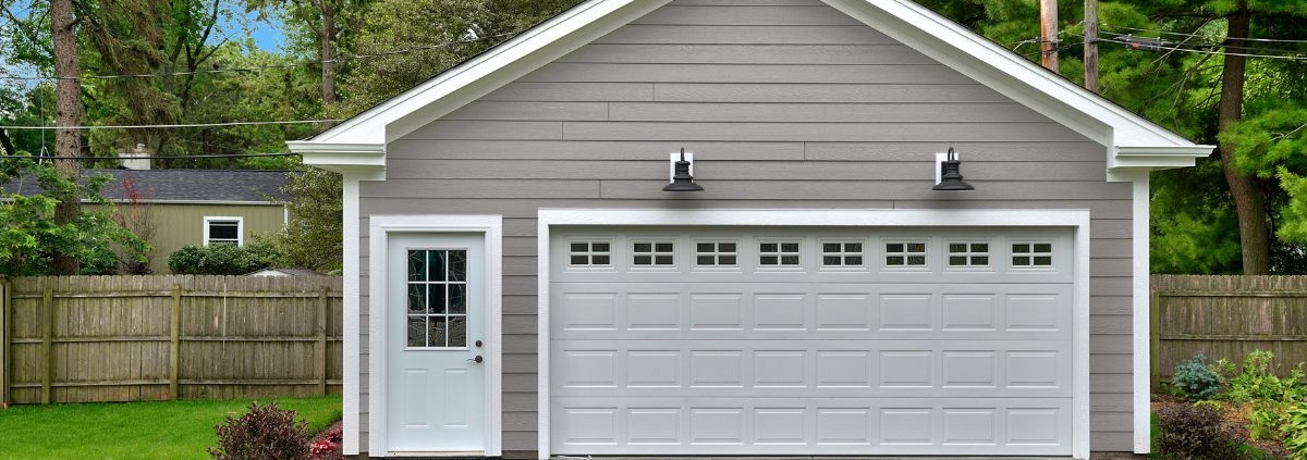 exterior of a detached garage with grey siding - Barefoot Construction Custom Garage Builders in Ham Lake