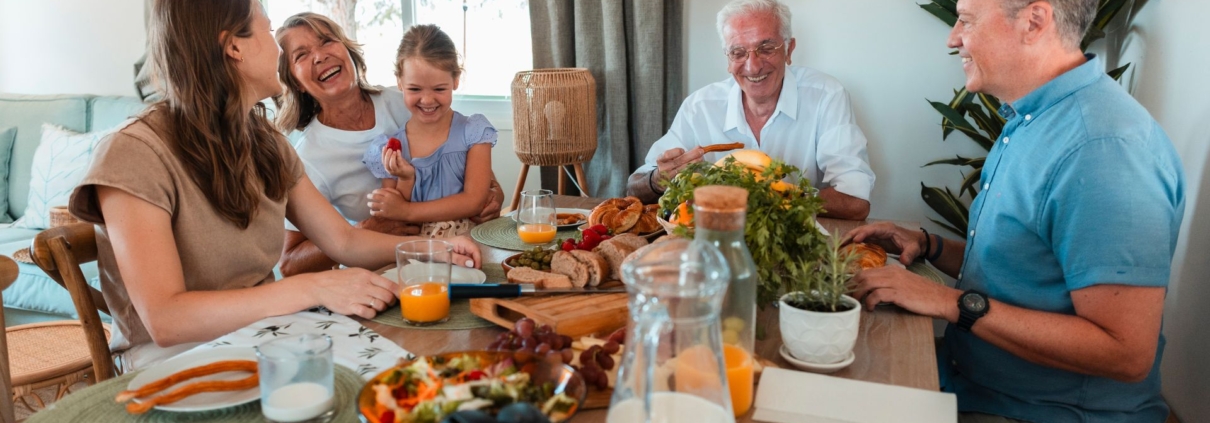 multi generational family eating dinner together - Barefoot Construction accessory dwelling units