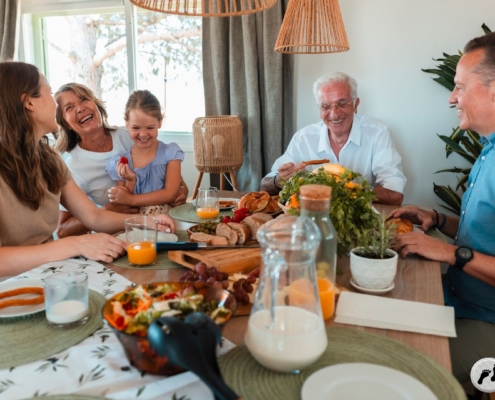multi generational family eating dinner together - Barefoot Construction accessory dwelling units