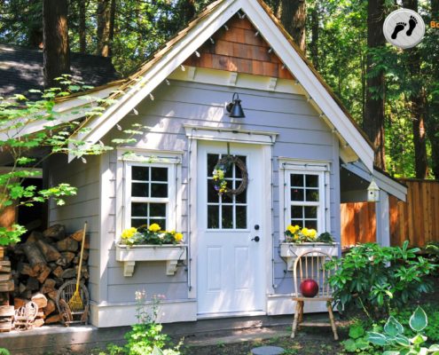exterior of an ADU with a pile of firewood - Barefoot Construction Accessory Dwelling Unit